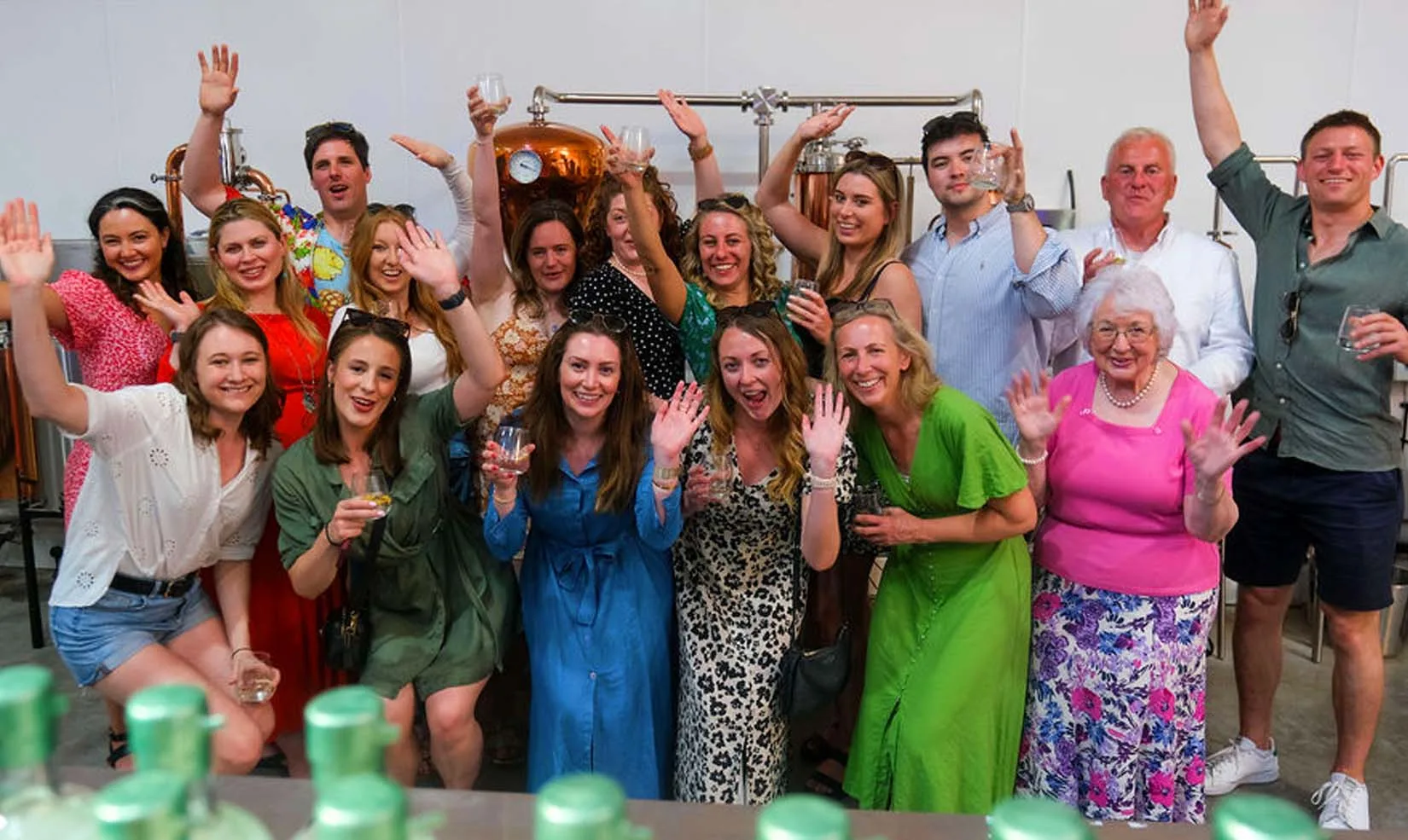 gin tour people raise glasses toast